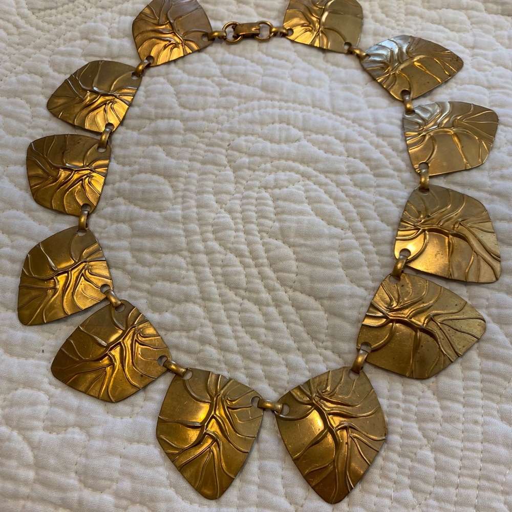 Brass chocker style necklace.